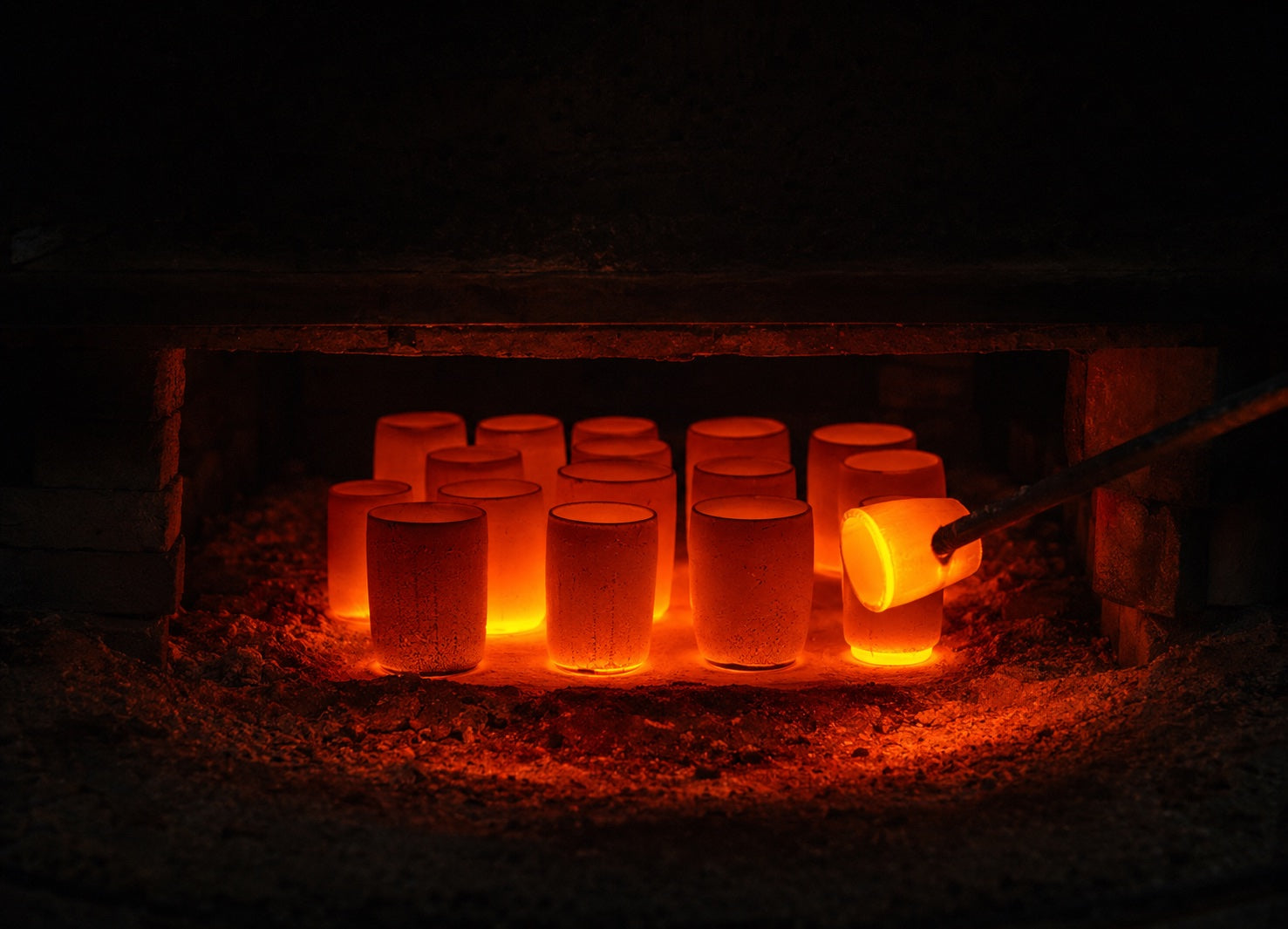 Japanese vessels glowing in a kiln during firing